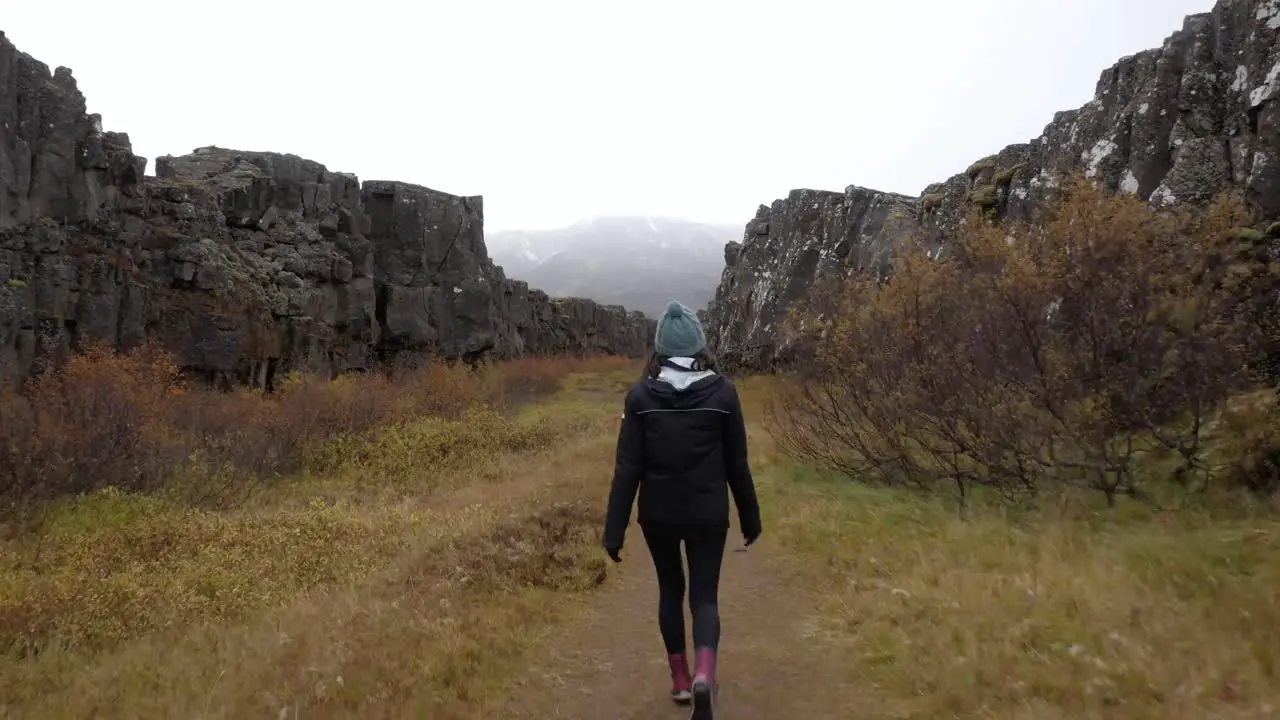 Young Woman Walking in an Icelandic Canyon Wide