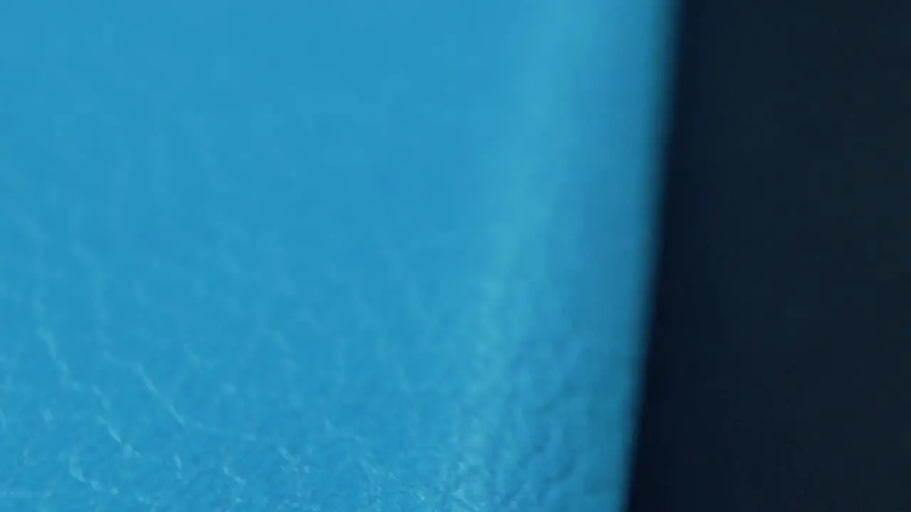 A macro close up shot of a blue abstract texture pattern material cinematic movement slow motion 120 fps Full HD