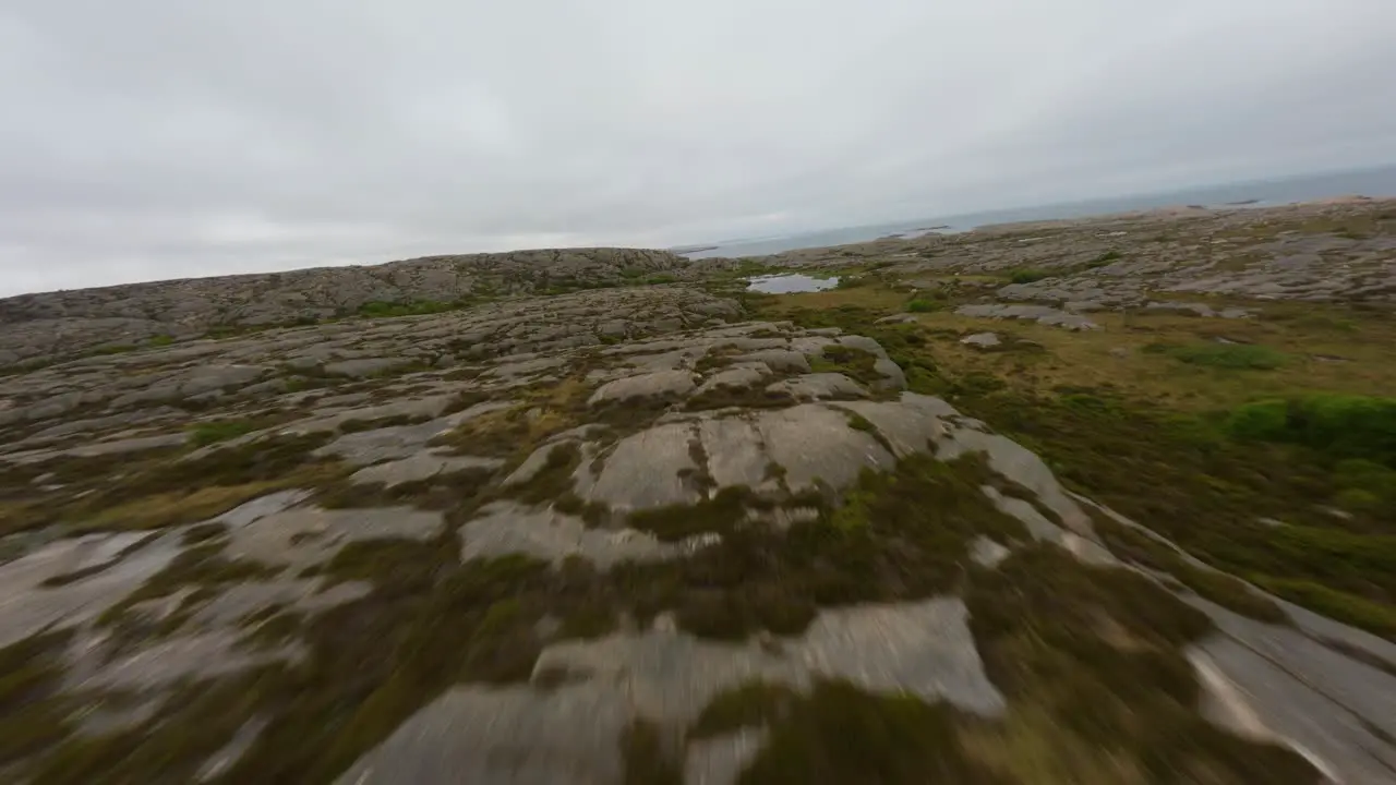 Drone flight over rocky terrain of Ramsvik in Sweden