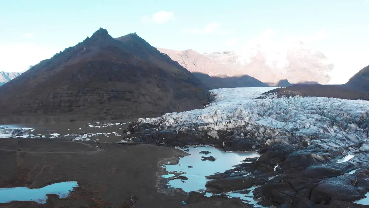 Mud and rocks below ice moraine of Svínafellsjökull glacier peak