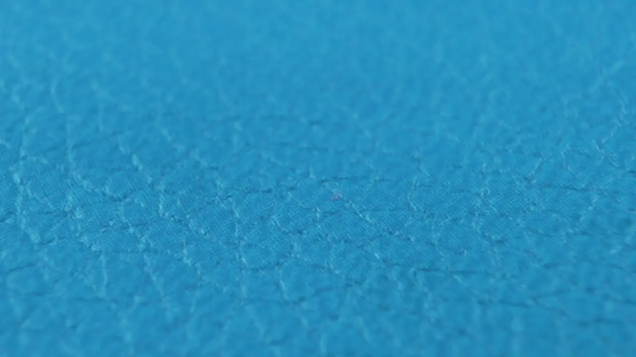 A detailed macro close up shot of a blue abstract texture pattern material cinematic movement slow motion 120 fps Full HD