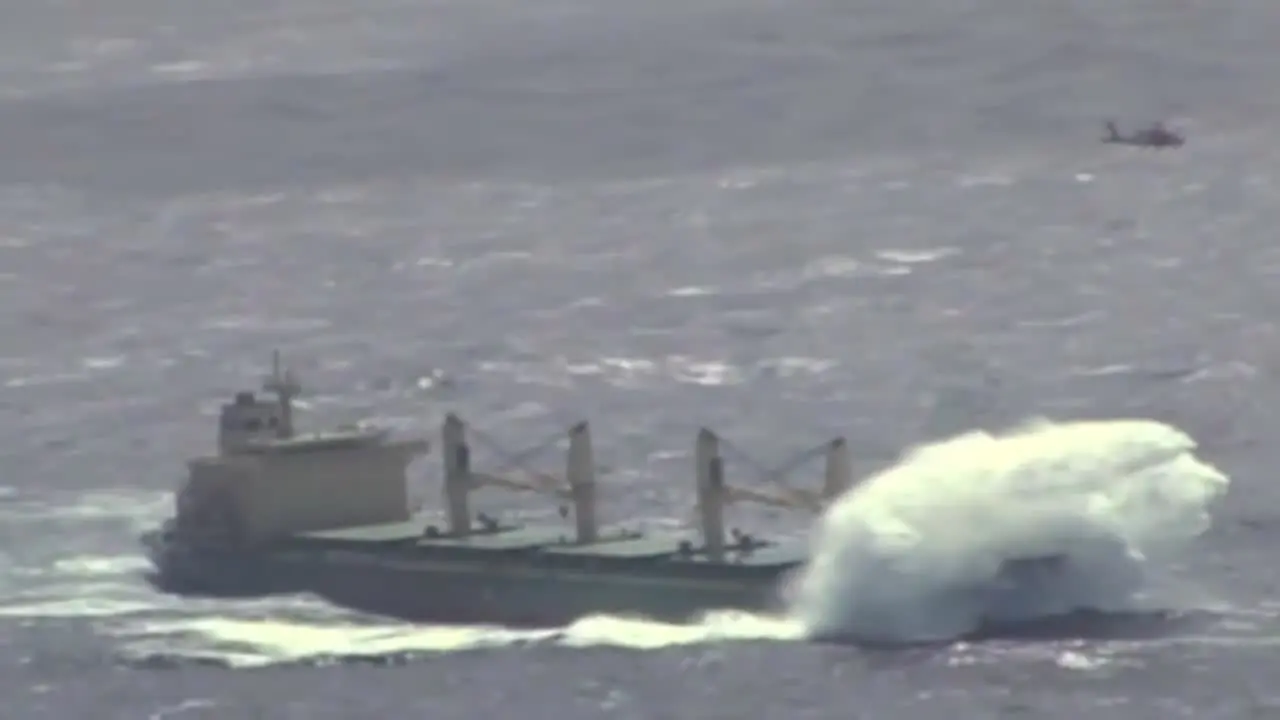 News Footage Of The Coast Guard Flying Above A Cargo Ship On The High Seas And Rescuing Or Airlifting A Crewman