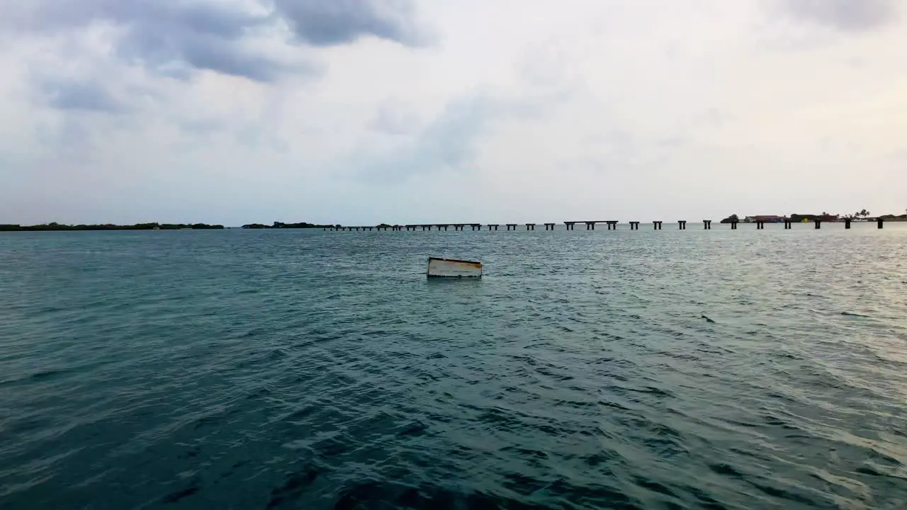 rusted metal box floating out to sea