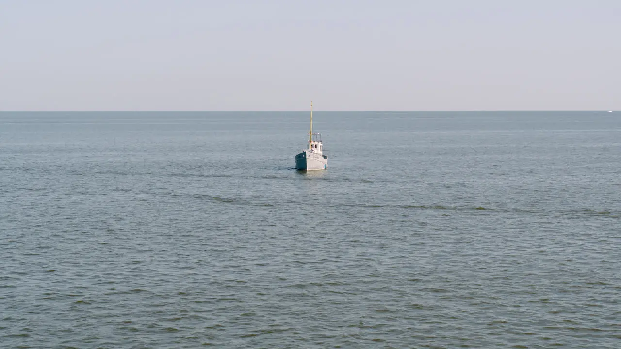 Small boat floating in water with bike inside