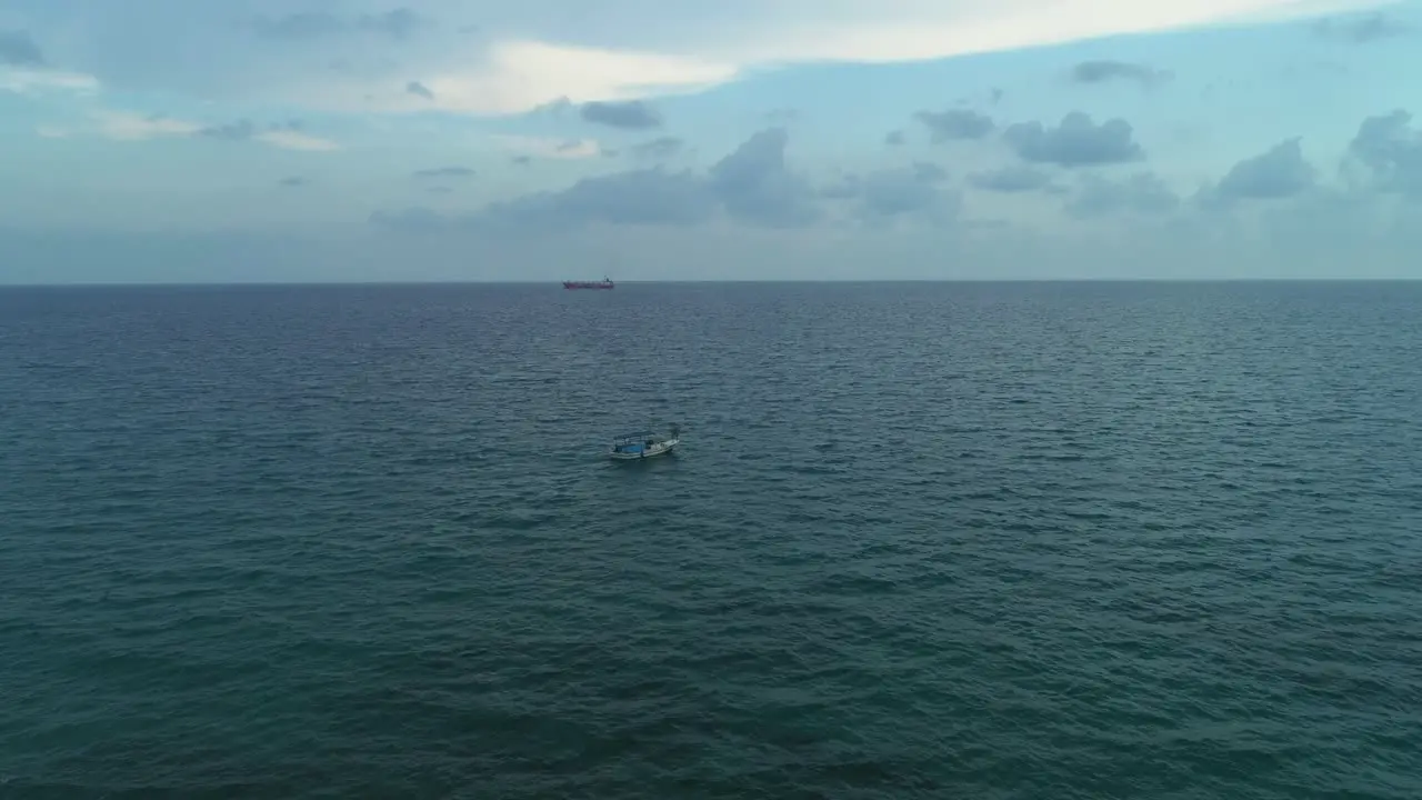 Aerial shot of the boat going in the middle of the sea