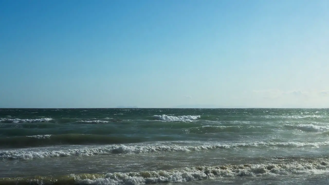 Ocean waves in slow motion on a clear windy day