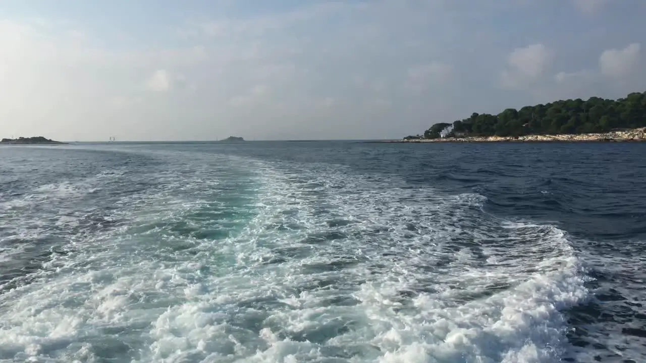 Croatia Coastline with Big Boat Trail and Lone Island at Sunset 4K