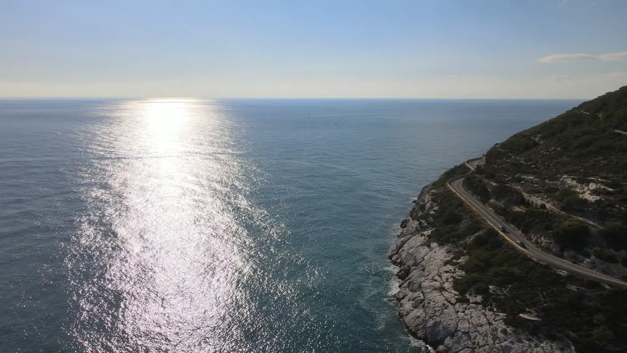 Aerial views of the coast cliffs nearby Barcelona with the sunshine on the sea