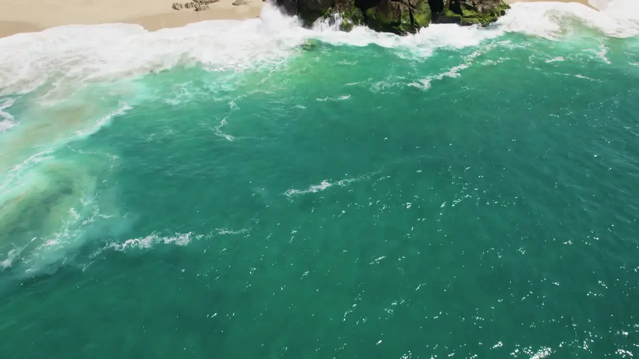 Aerial drone shot of waves crashing on sea cliffs in Cabo San Lucas Mexico-2