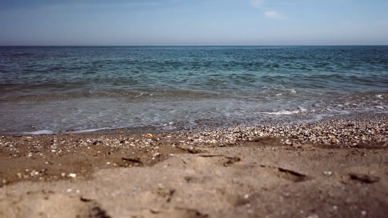 Calm ocean waves in slow motion at the beach