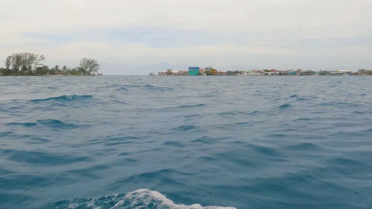 Low angle sea-level ocean view from small boat sailing in calm open Caribbean sea