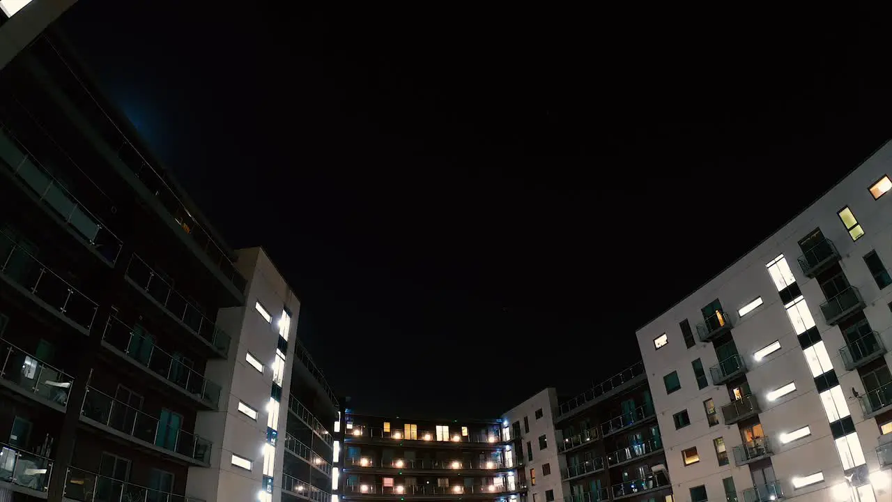 Moon moving over the buildings night lapse