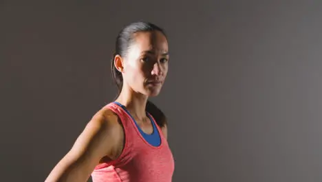 Tracking Shot of Young Woman Looking at Camera at Gym