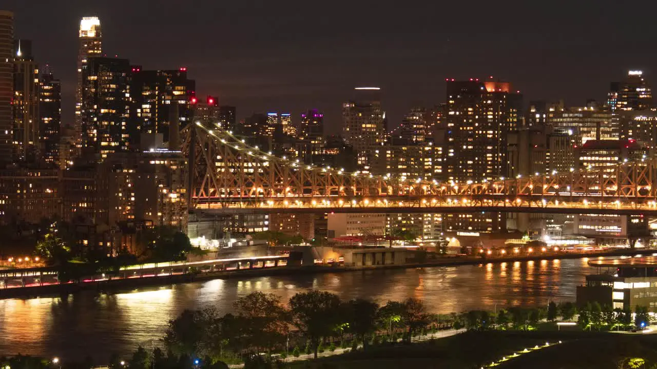 Traffic at FDR Drive Ed Koch Queensboro Bridge Roosevelt Island East River and East Side Manhattan at night Time Lapse cropped version