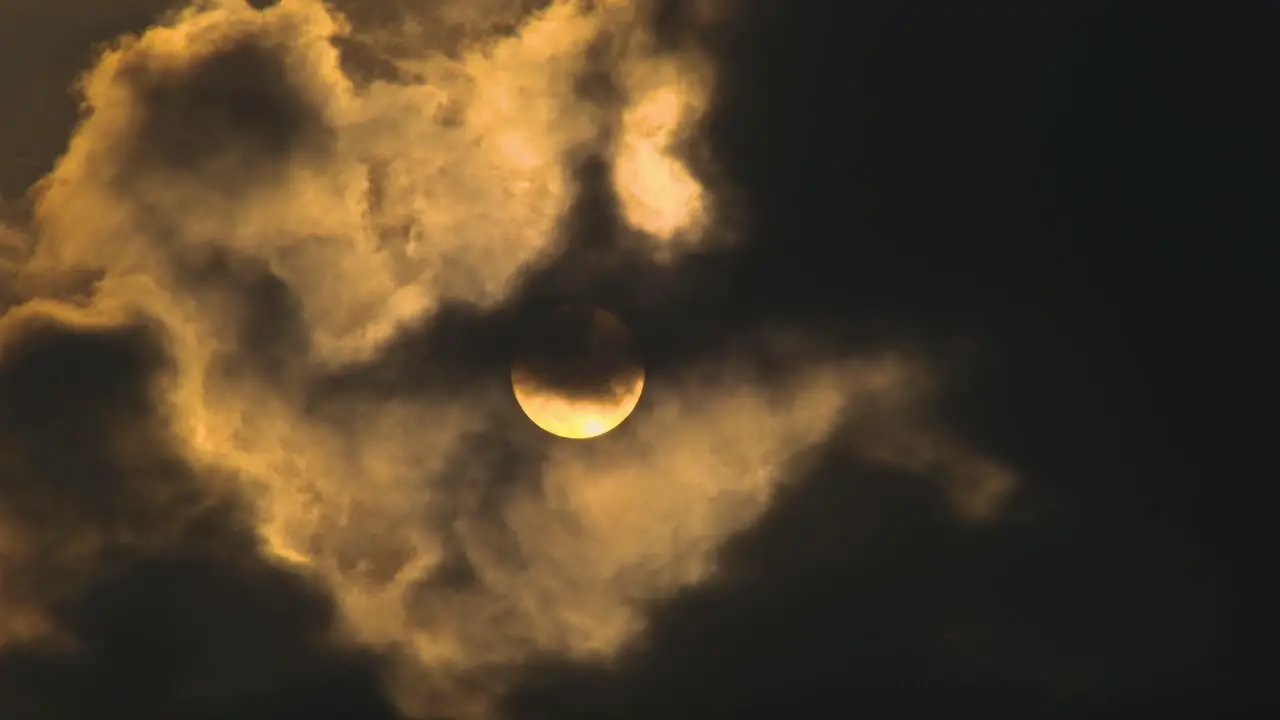 Full moon with clouds moving in front of it