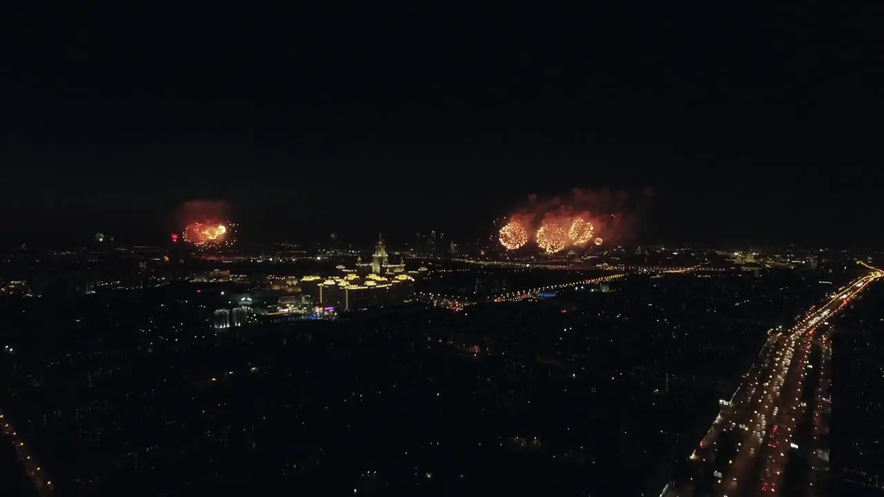 Aerial night view of the Leninsky Avenue and sparkling fireworks Moscow Russia