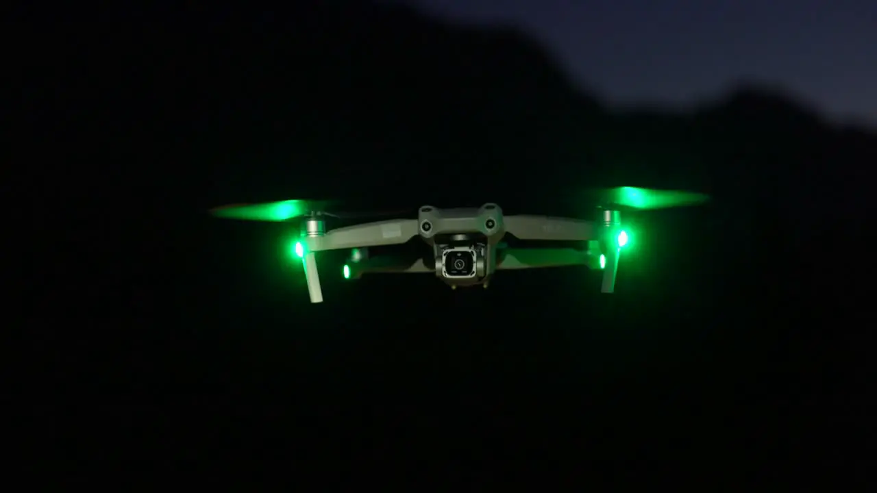 DJI Air 2S drone flying at night with green safety lights professional camera drone