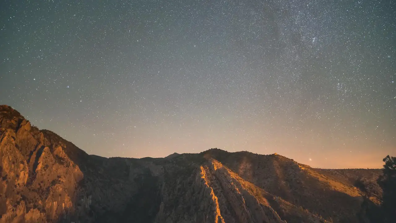 North star and sky rotation timelapse during a summer night with dark sky and satellite trails