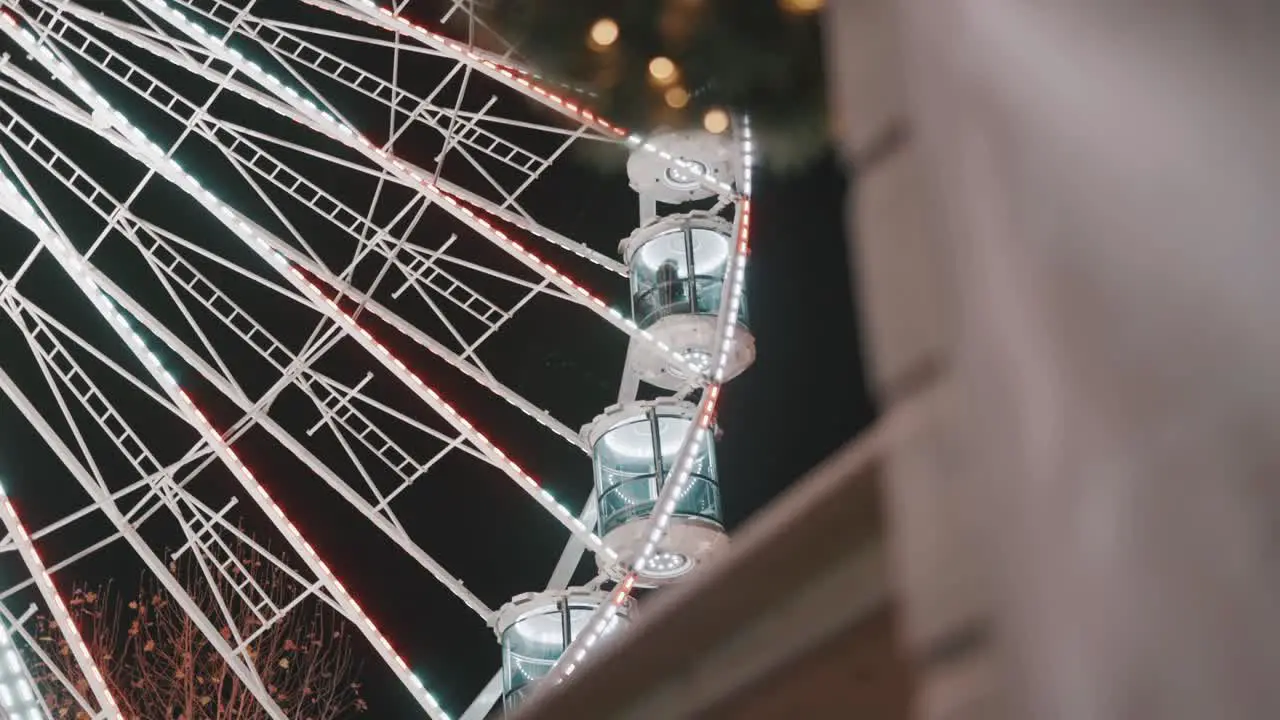 close up ferris wheel turning at Christmas market at night time in Maastricht the Netherlands