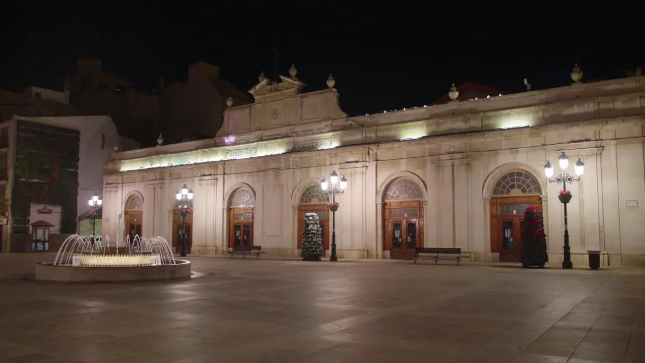 Night View Of Central Market Building And Fountain On Empty Plaza Mayor Castellon de la Plana Spain