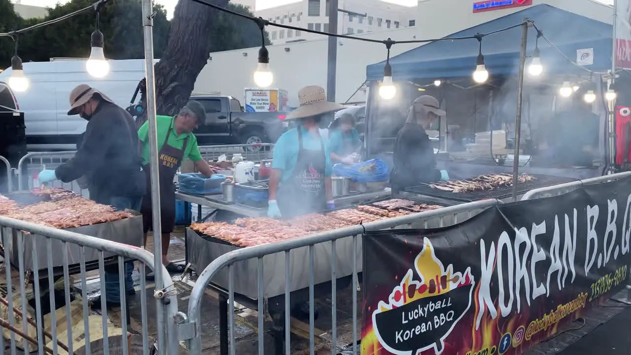 Korean BBQ stand outdoor cooking at the Santa Monica night market in Los Angeles static view