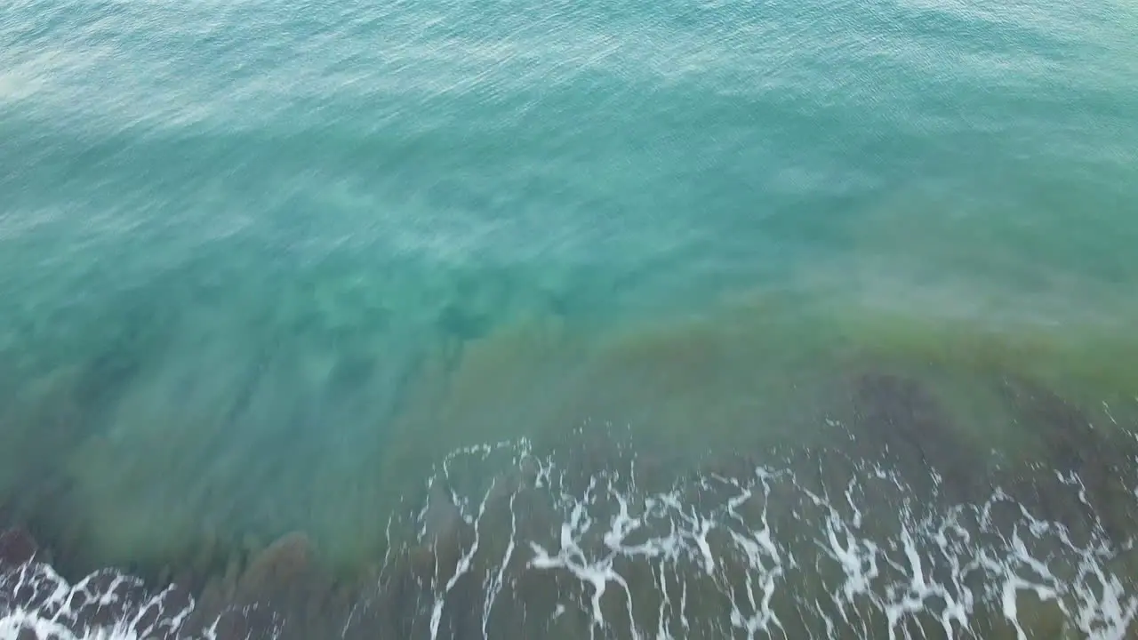 Drone shot of waves in the seashore