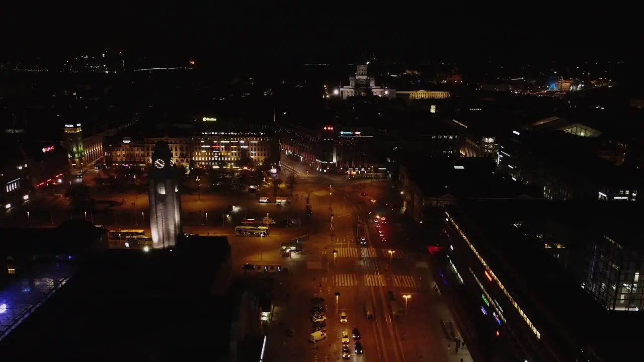 Flyover Railway Square train station lit up on dark Helsinki night