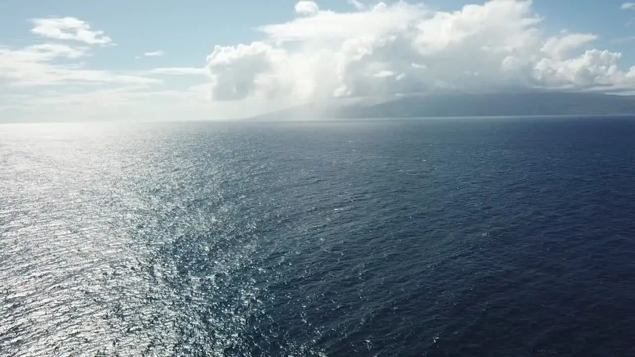 peaceful ocean waves with large clouds