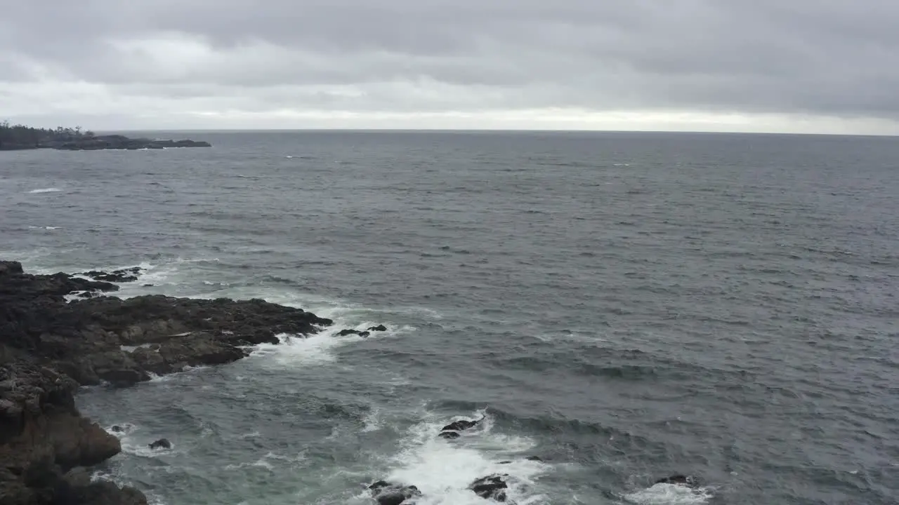 Rough Waves Onto Rock Shore Of Tofino In Vancouver Island West Coast Canada