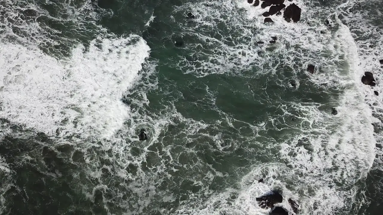 Rocky Coast With Rough Seas Aerial Flyover