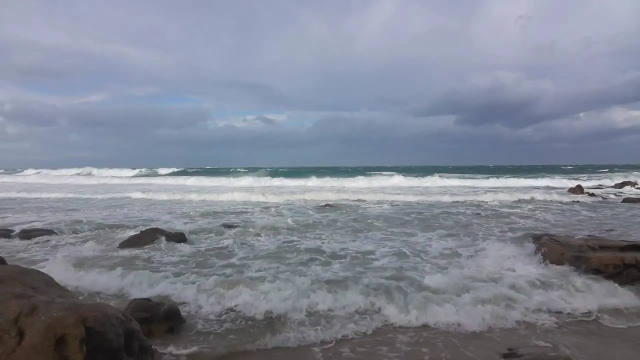 Waves pounding the coastal shoreline