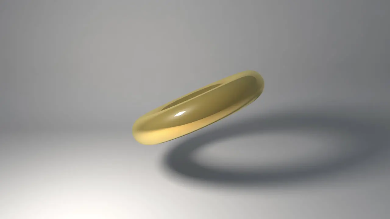 Abstract Golden ring spinning on a white background