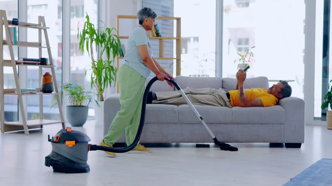 Housekeeping vacuum and woman cleaning the living