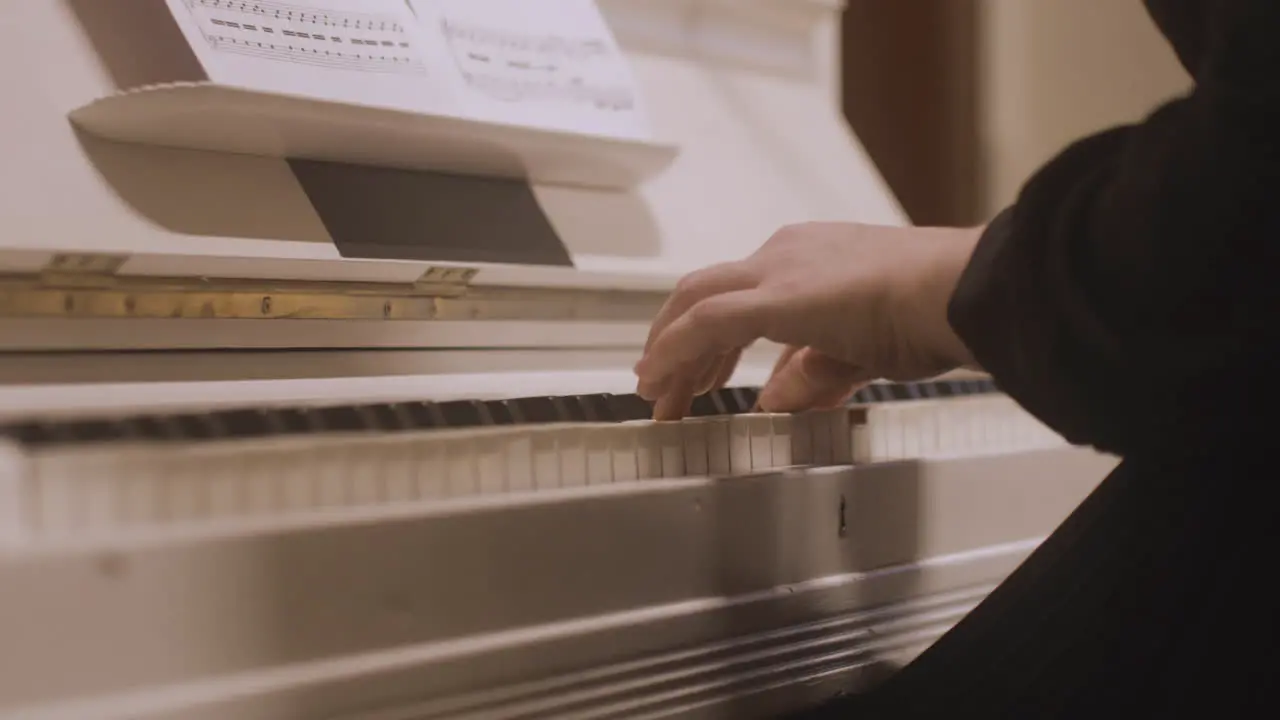 Close Up Of A Female Hands Playing Piano