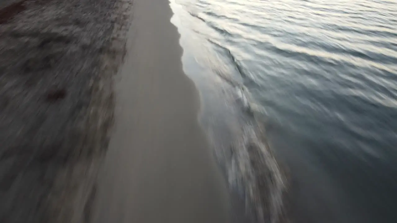 Small waves breaking at the beach of corsica