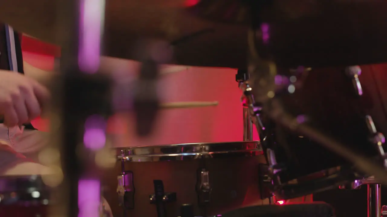 Unrecognizable Man Playing Drums In Recording Studio 1