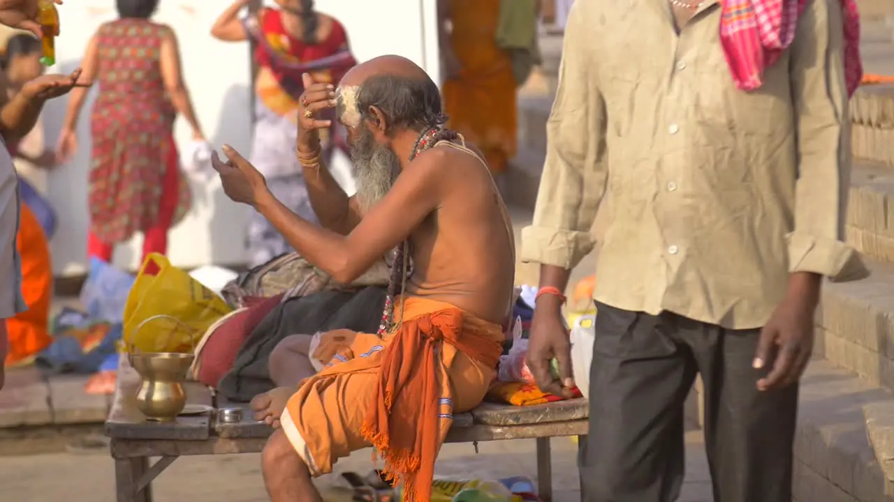 Sadhu Applying Devotional Face Paint