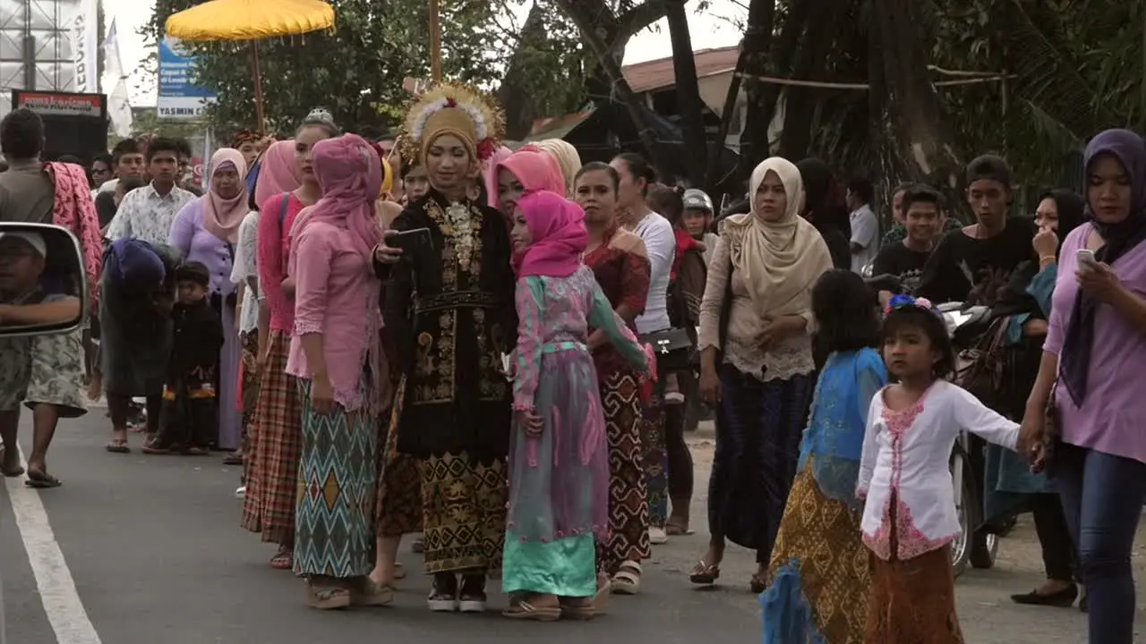 Women Taking a Selfie in Wedding Procession