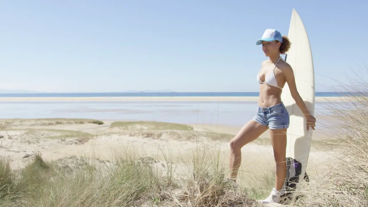 Female with surf admiring waterscape