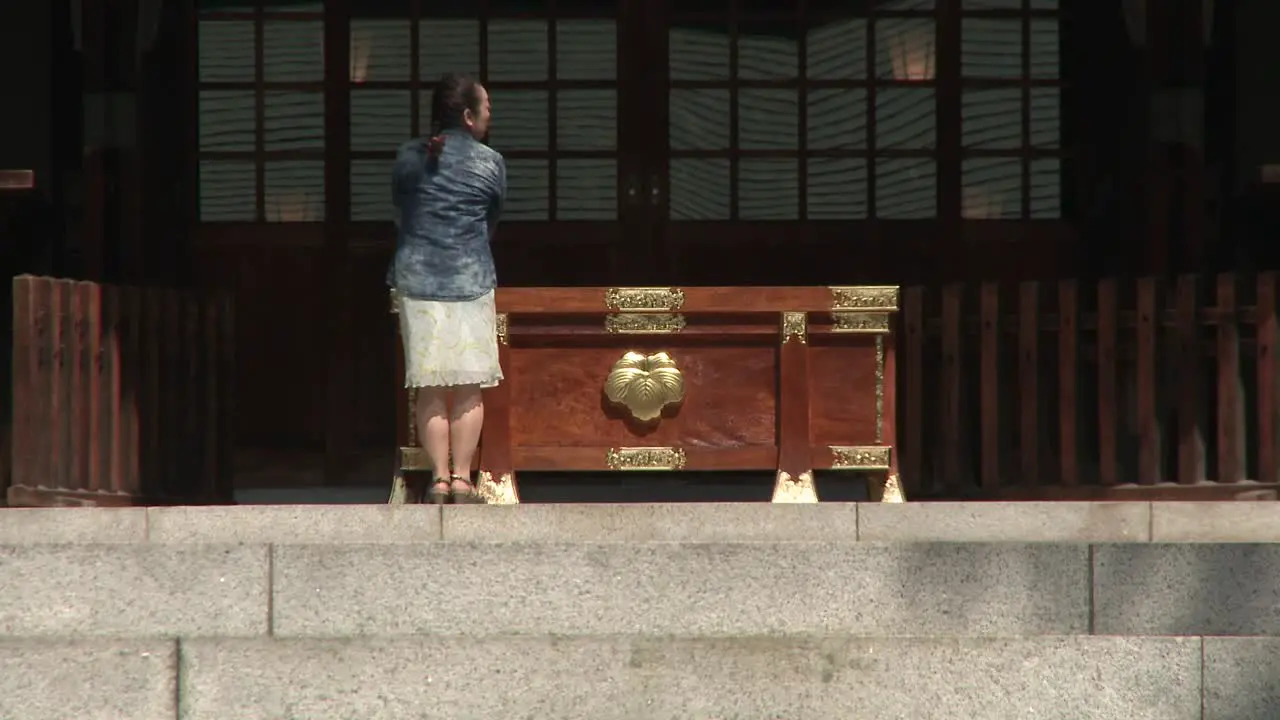 Woman Praying in Temple