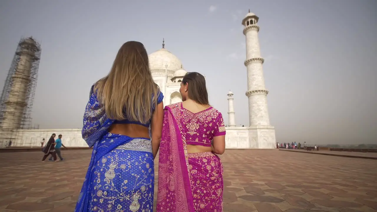 Panning Shot of Two Girls at the Taj Mahal