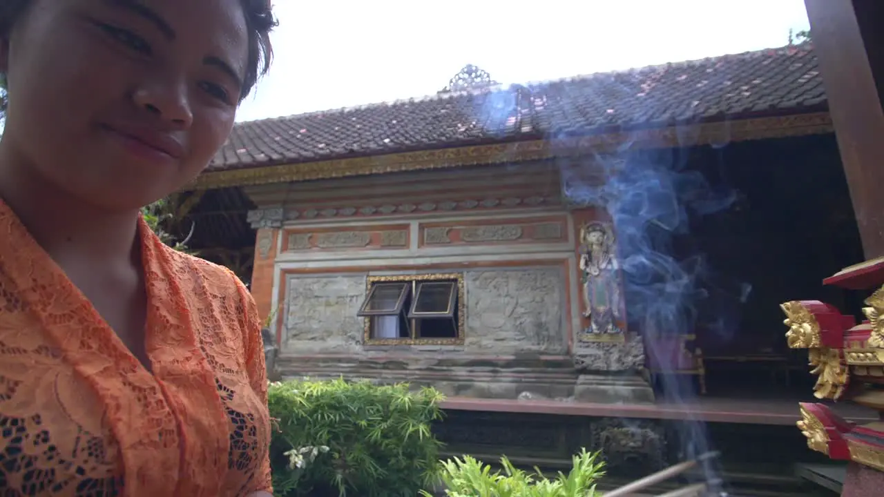 Woman Burning Incense in a Hindu Temple