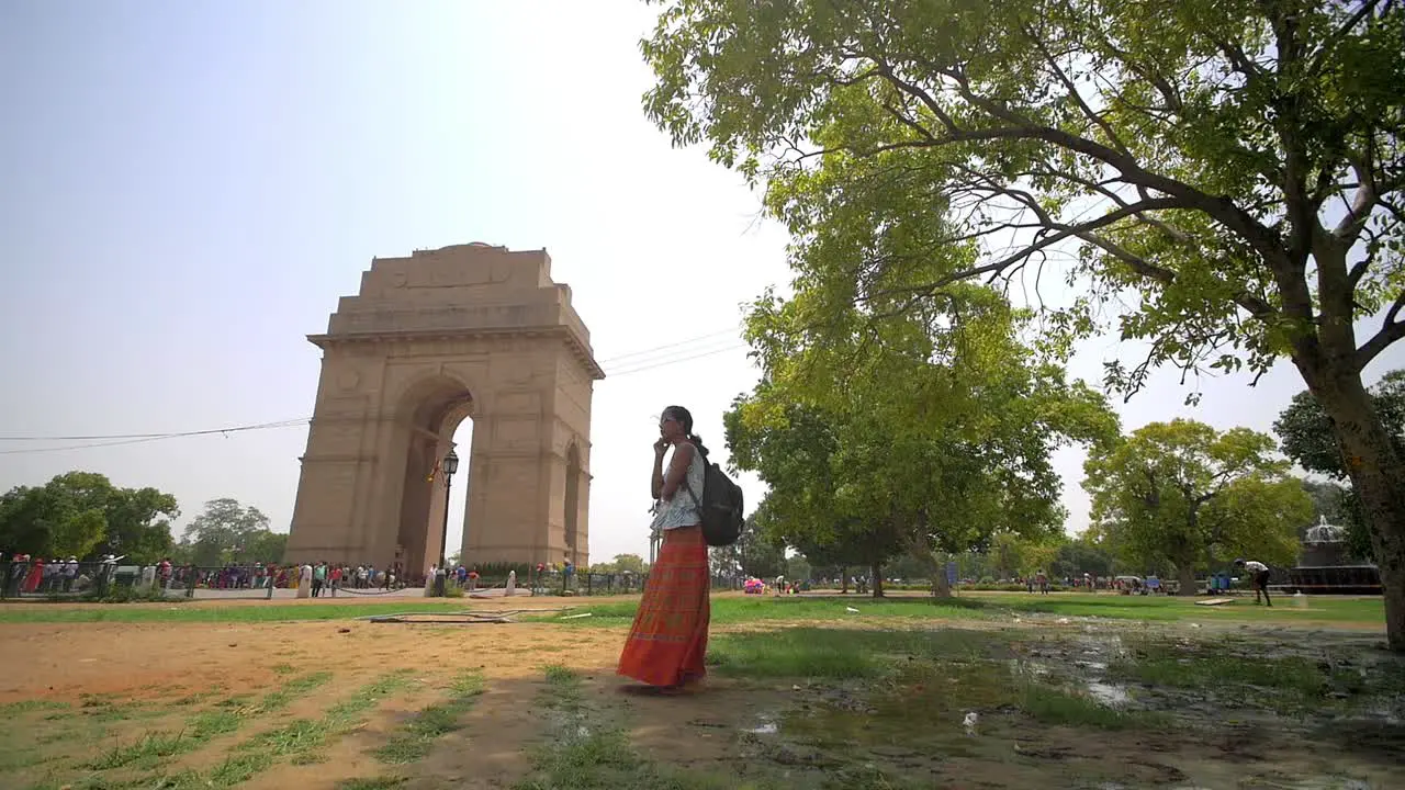 Woman Using Phone at India Gate