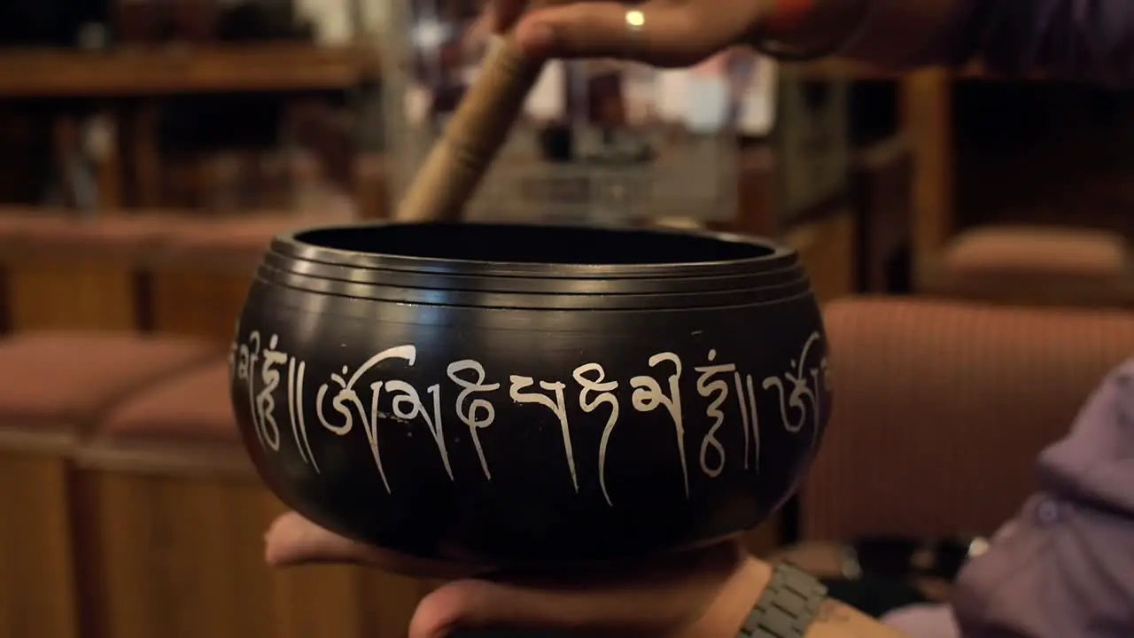 Close-Up Shot of a Singing Bowl in Use