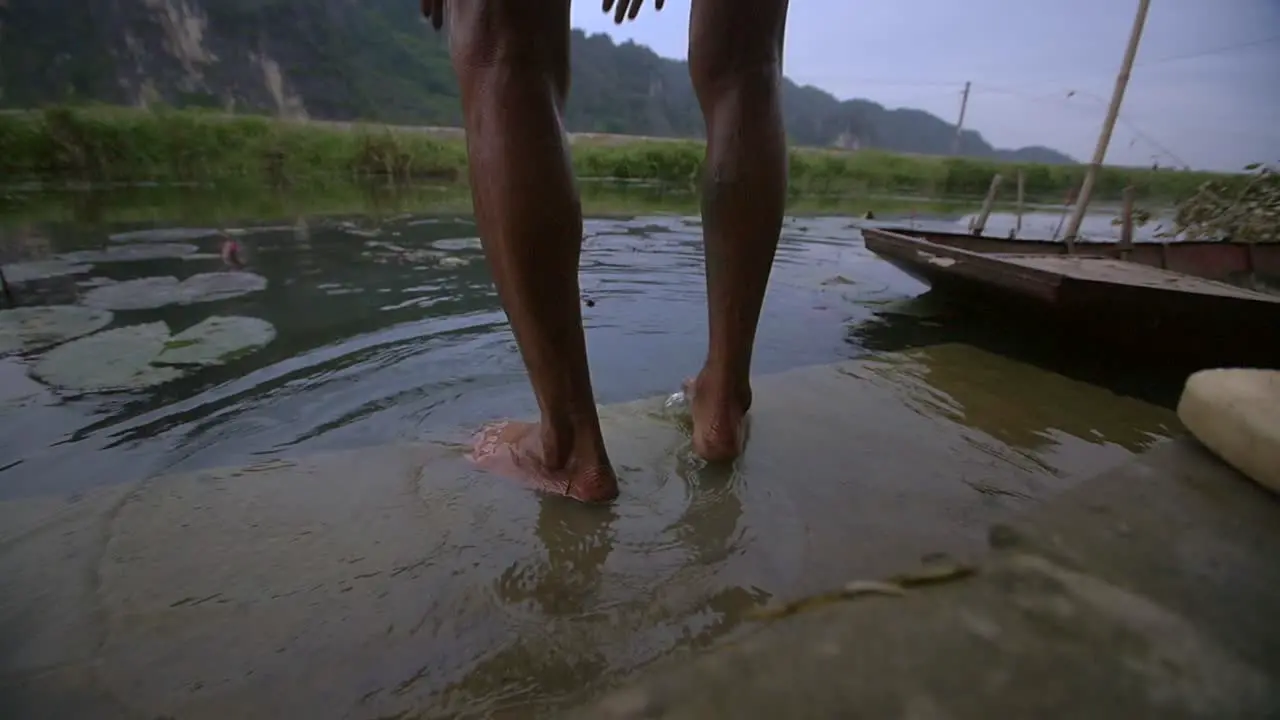 Vietnamese Man Washing in River