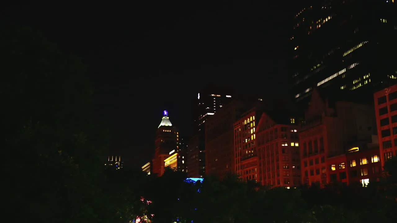 Tall lit up towers illuminate Chicago's streets at night