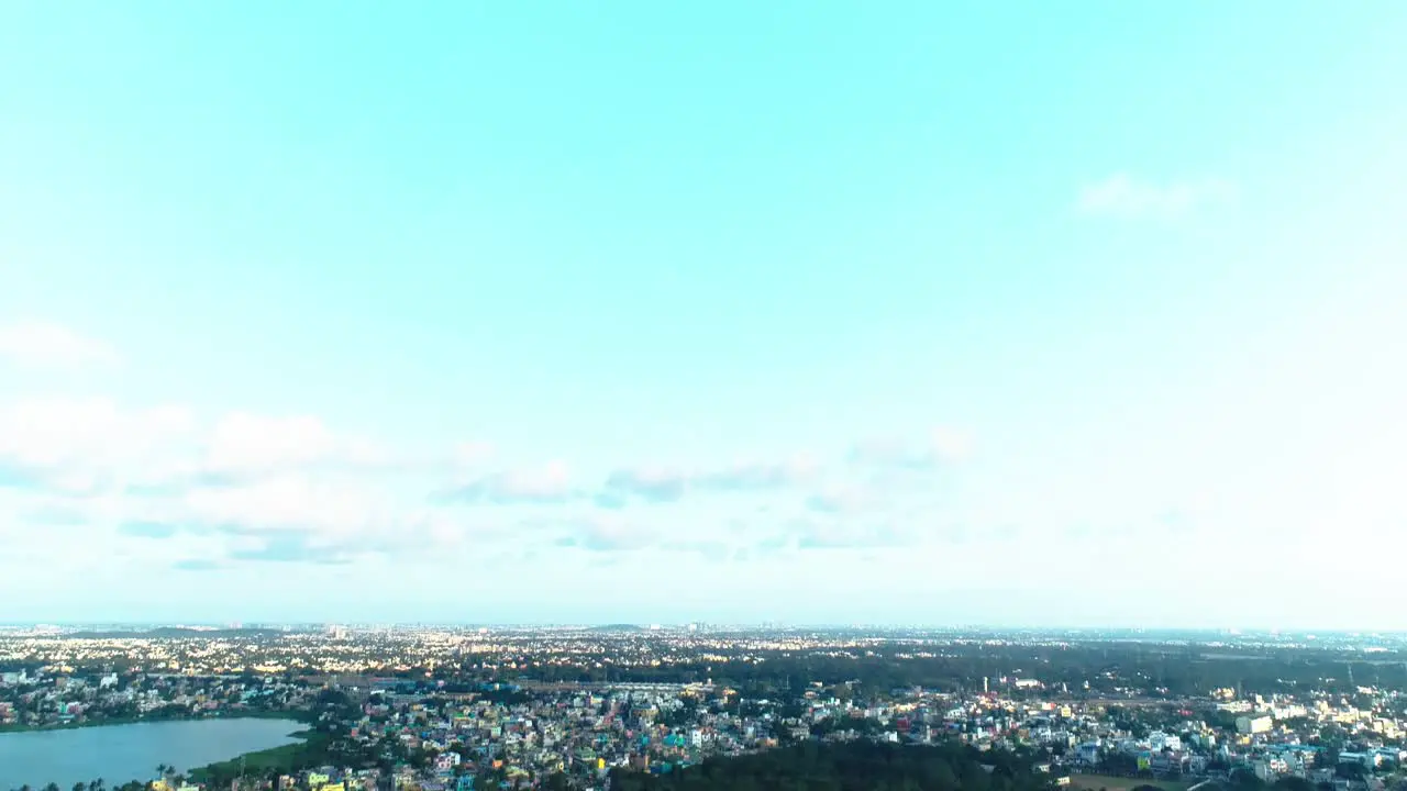 Drone shot showing houses and roads with water bodies