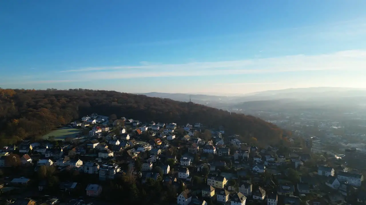 A city in nature surrounded by fog