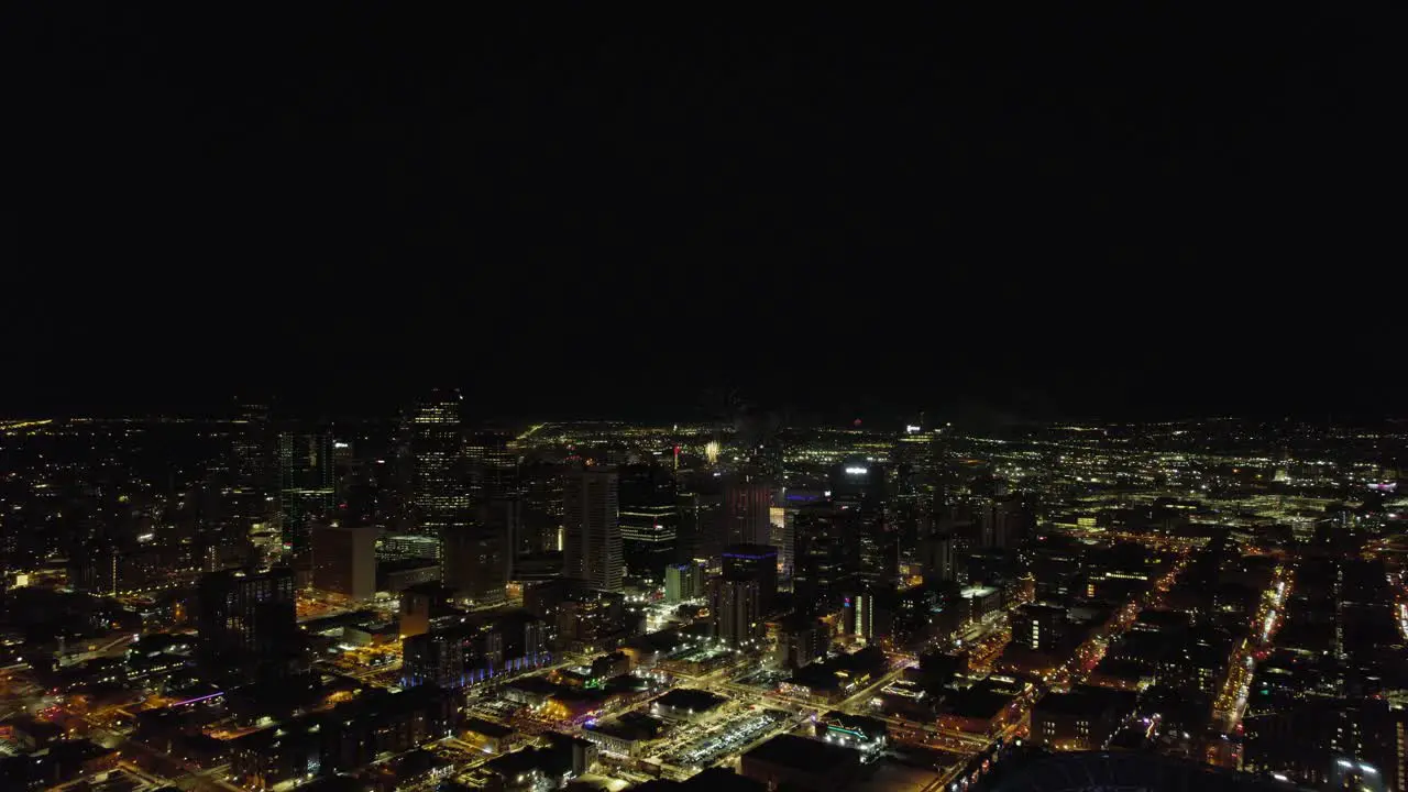 Fireworks Celebration Exploding Over Downtown Denver Skyline Buildings During Nighttime