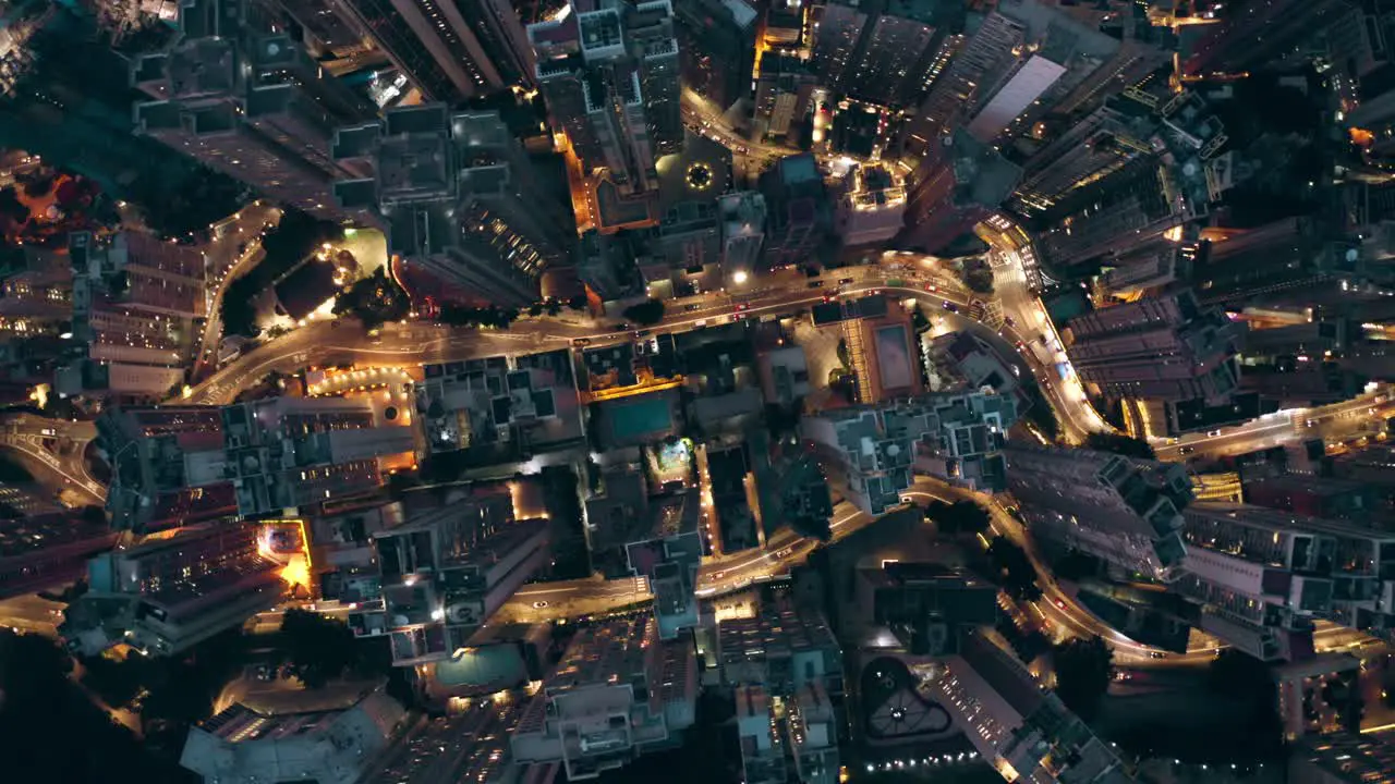 Drone shot of a city full of skyscrapers view from a bird during the night a lot of roads with busy traffics